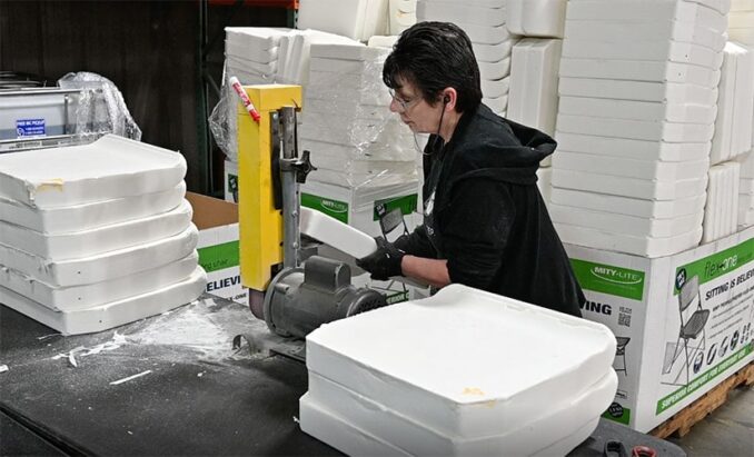 Bertolini employee tidying foam