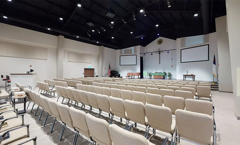 Cream-colored chairs in a church hall