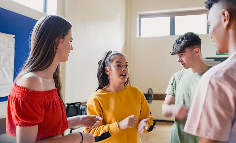 Youth chatting in a multi-purpose space